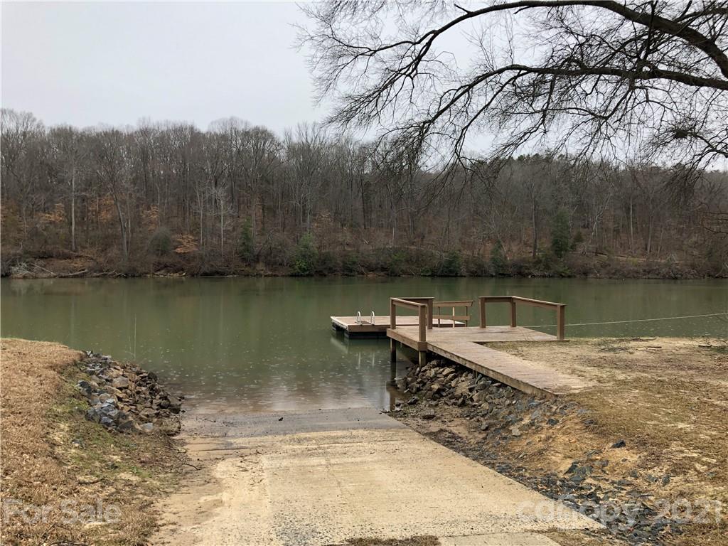 1420 Riverside Drive Charlotte, NC 28214 - Photo 5 of 13 a view of a water pond with green yard