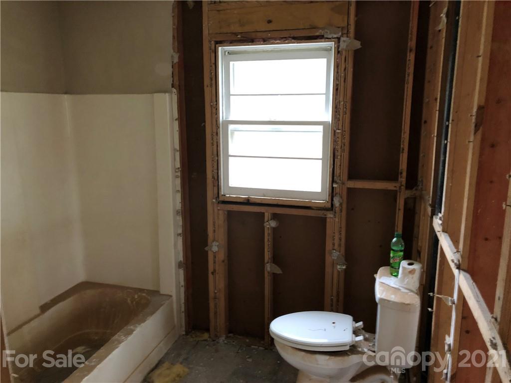 1420 Riverside Drive Charlotte, NC 28214 - Photo 6 of 13 a bathroom with a toilet and a shower