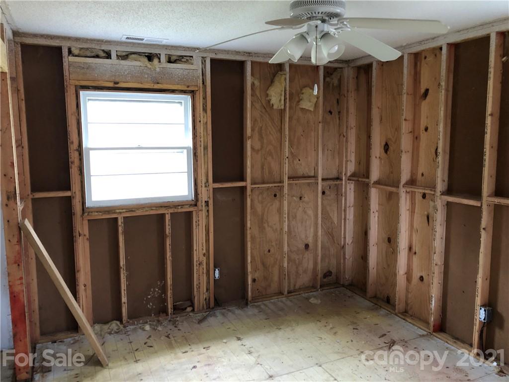 1420 Riverside Drive Charlotte, NC 28214 - Photo 7 of 13 a view of a hallway with a door