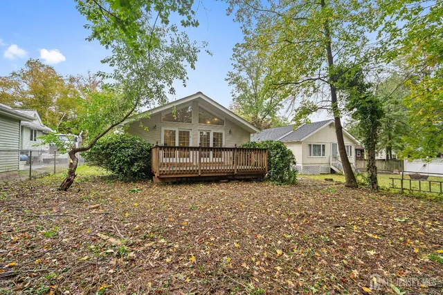 a house with trees in the background