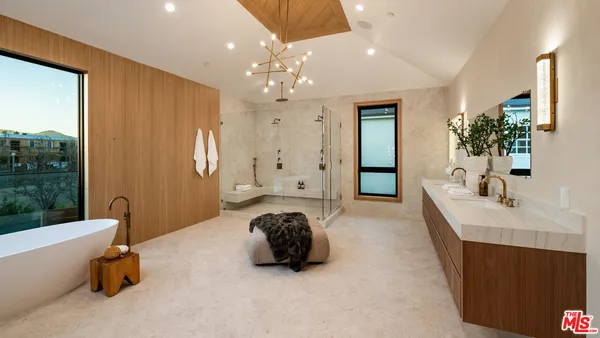 a spacious bedroom with a large bed and a couch