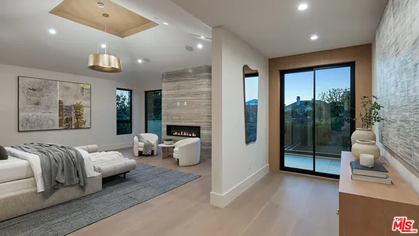 a bedroom with a bed and a table in it