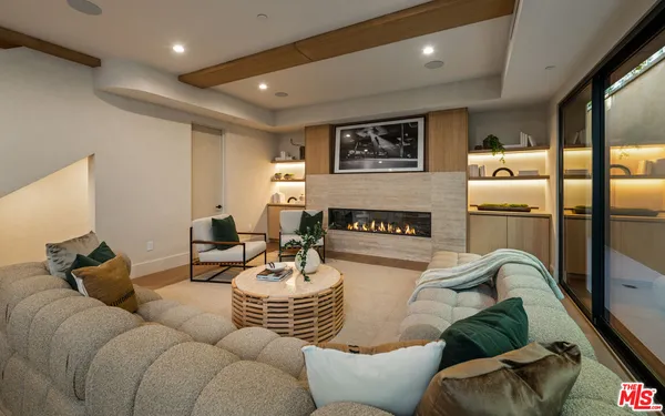a spacious bedroom with a bed and a couch