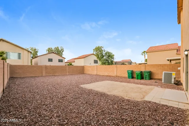 a view of a house with a yard and garage