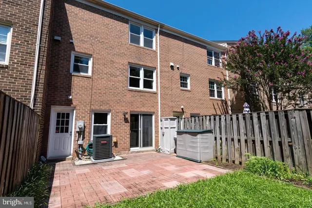 a view of barbeque area with wooden fence