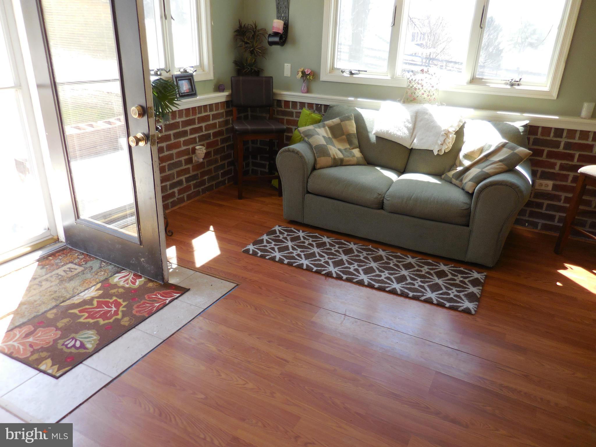 16613 Trenton Road Upperco, MD 21155 - Photo 12 of 15 a living room with furniture and a rug