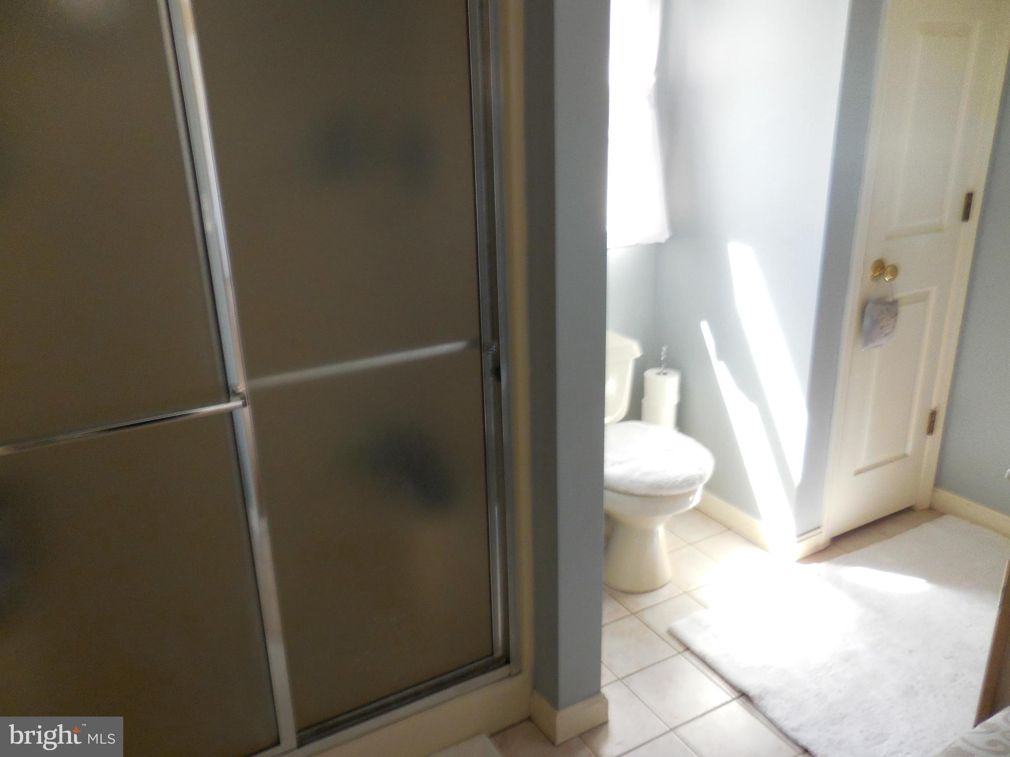 16613 Trenton Road Upperco, MD 21155 - Photo 13 of 15 a bathroom with a toilet and a shower