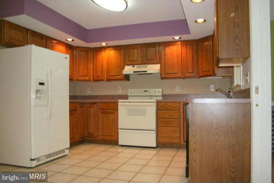 16613 Trenton Road Upperco, MD 21155 - Photo 4 of 15 a kitchen with stainless steel appliances a refrigerator sink and cabinets