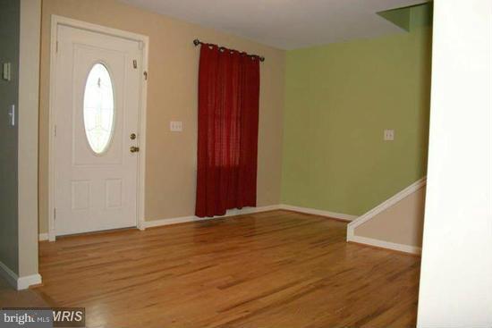16613 Trenton Road Upperco, MD 21155 - Photo 7 of 15 a view of a room with wooden floor and white walls