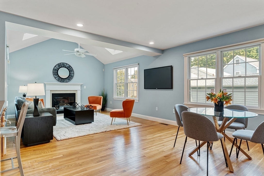 166 Forest Street Winchester, MA 01890 - Photo 11 of 37 a living room with furniture a fireplace and a flat screen tv