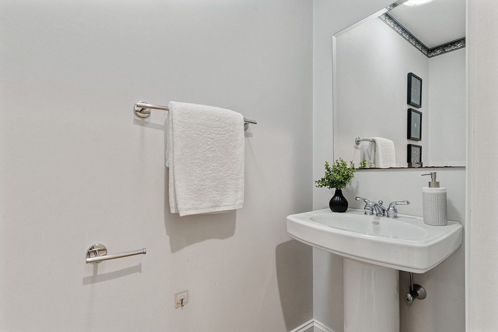166 Forest Street Winchester, MA 01890 - Photo 15 of 37 a bathroom with a sink and a mirror