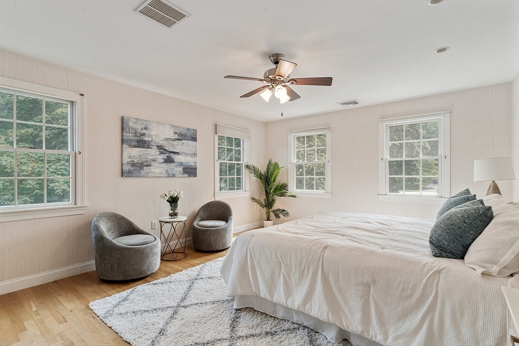166 Forest Street Winchester, MA 01890 - Photo 17 of 37 a bedroom with a bed and wooden floor