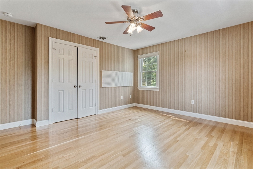 166 Forest Street Winchester, MA 01890 - Photo 20 of 37 wooden floor in an empty room with a window