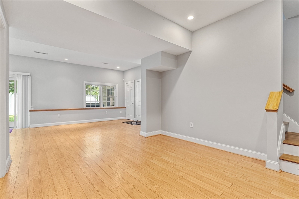 166 Forest Street Winchester, MA 01890 - Photo 27 of 37 a view of empty room with wooden floor and fan