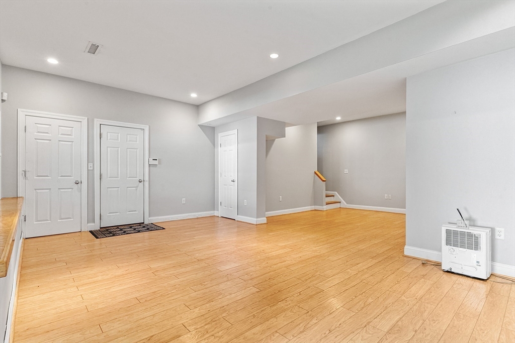 166 Forest Street Winchester, MA 01890 - Photo 28 of 37 a view of an empty room with wooden floor