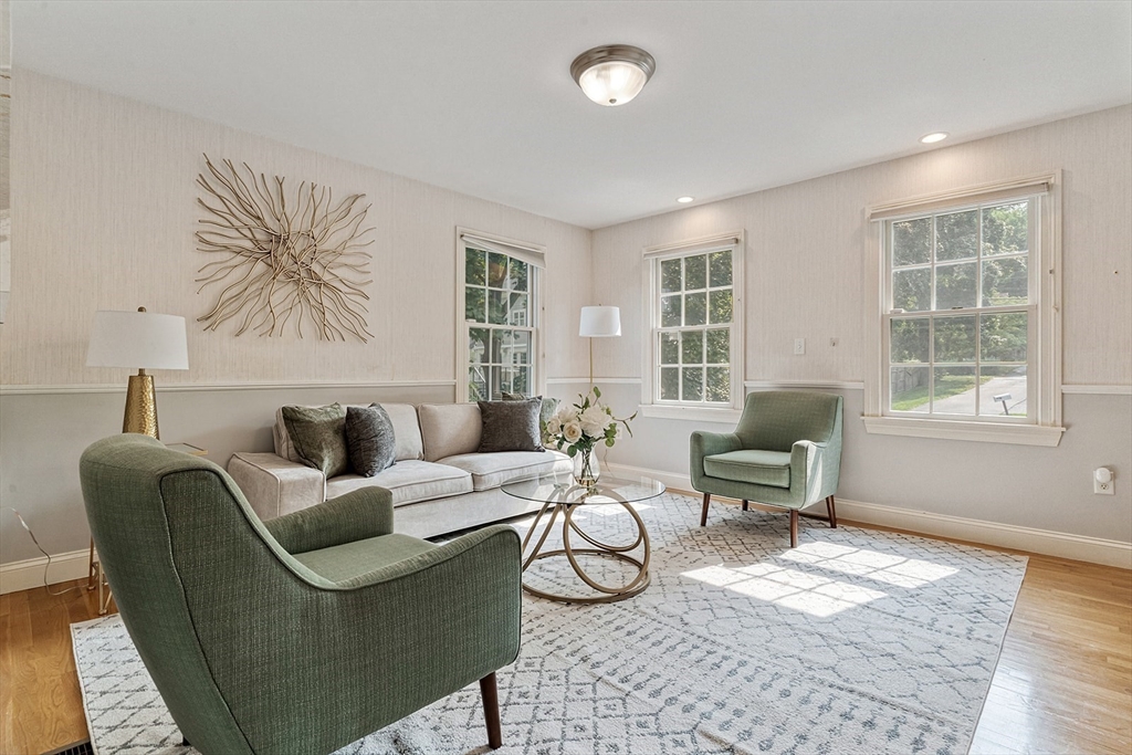 166 Forest Street Winchester, MA 01890 - Photo 3 of 37 a living room with furniture a table and a window