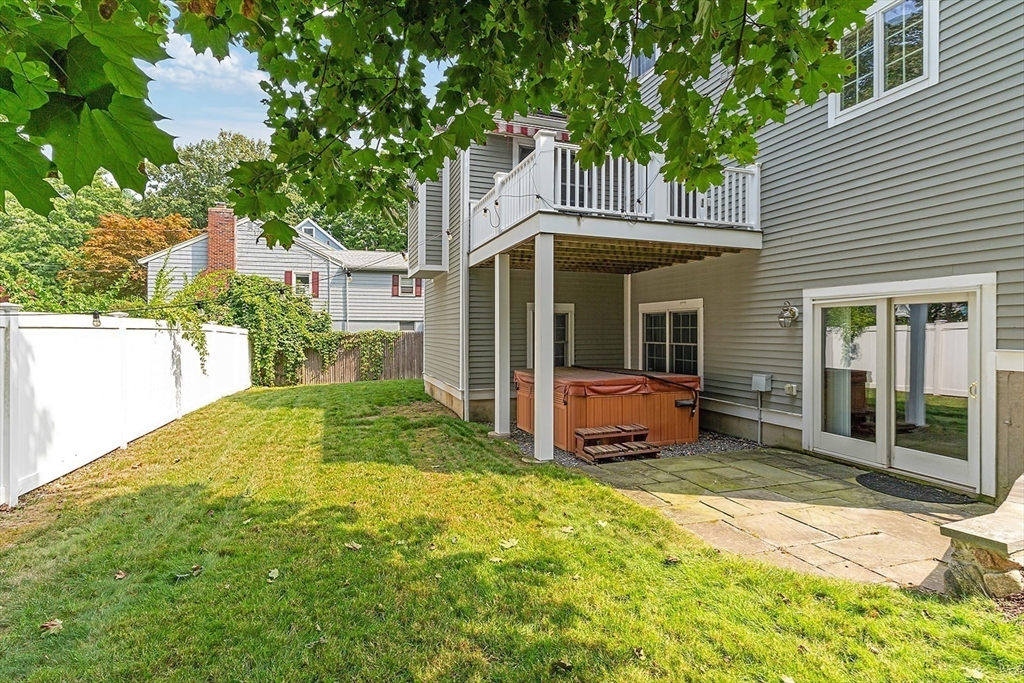 166 Forest Street Winchester, MA 01890 - Photo 33 of 37 a front view of a house with garden