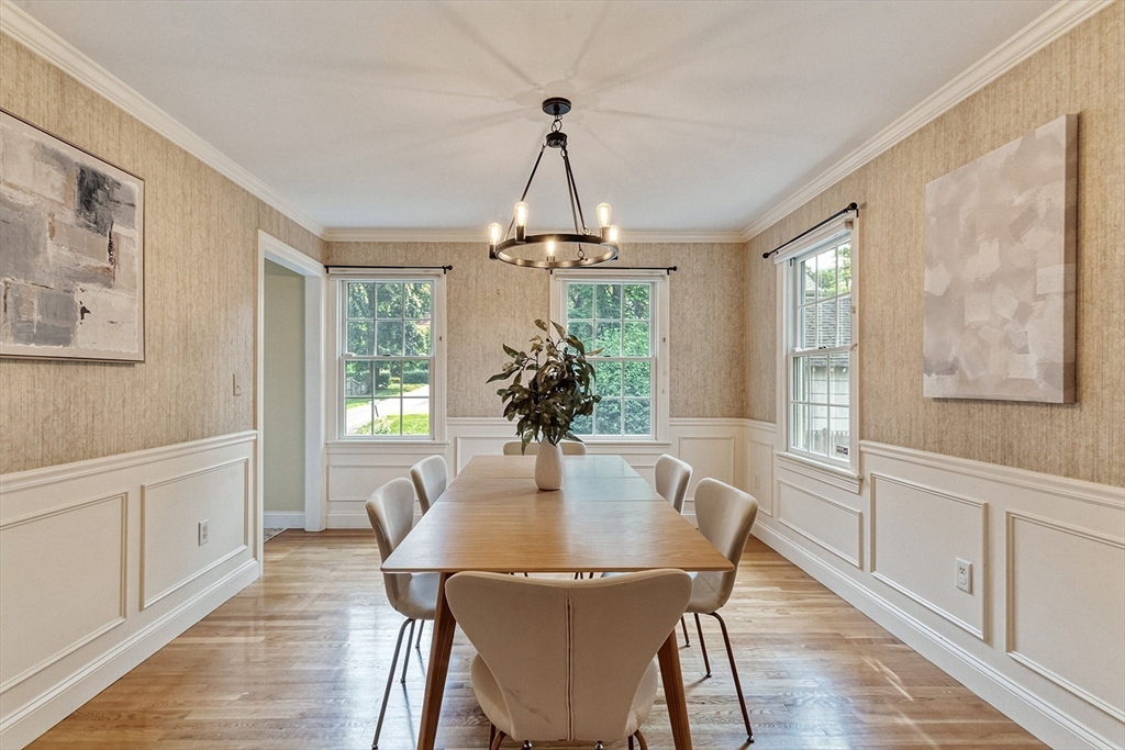 166 Forest Street Winchester, MA 01890 - Photo 6 of 37 a dining room with furniture a chandelier and wooden floor