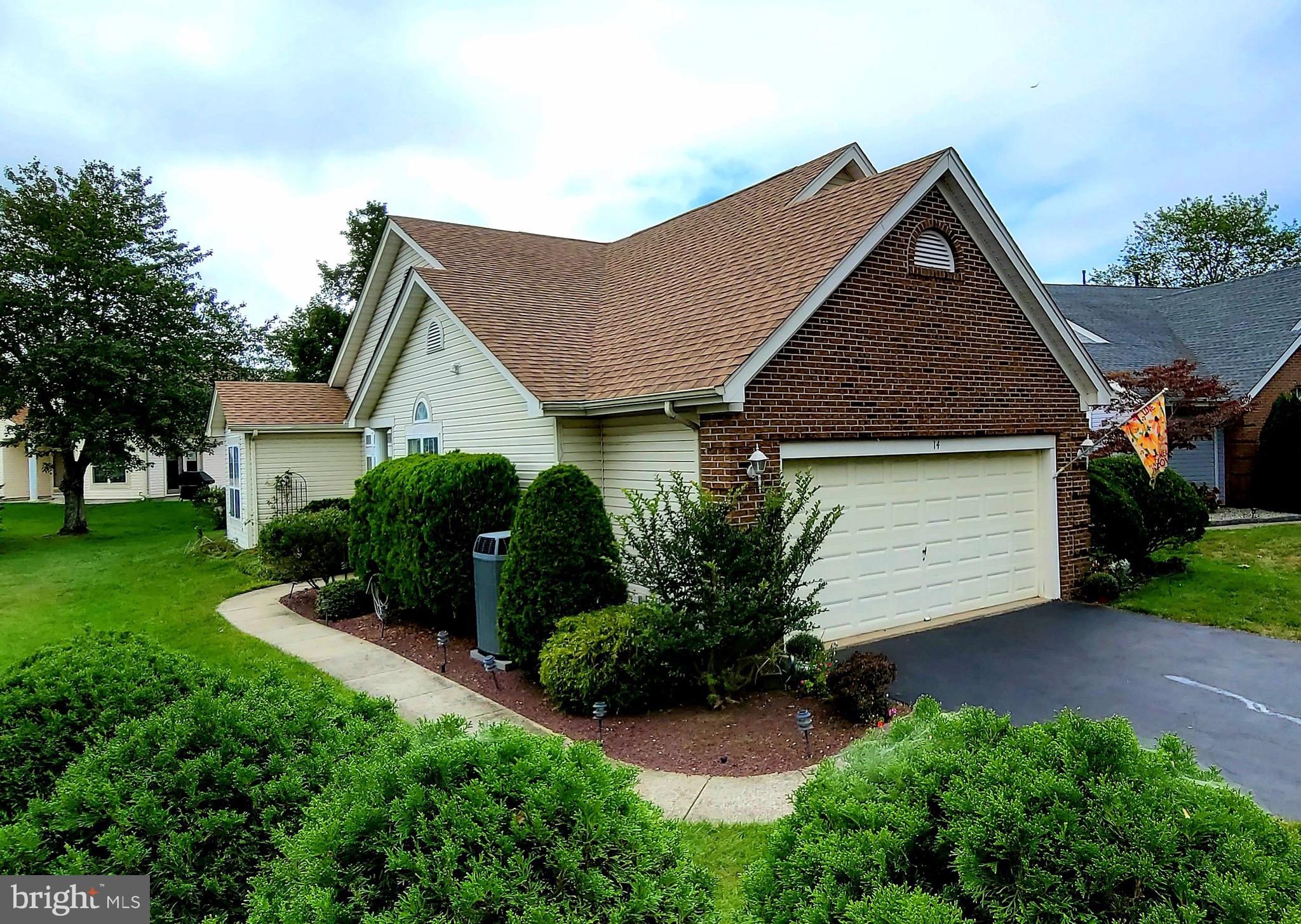 14 Wharfside Way Bayville, NJ 08721 - Photo 1 of 30 a front view of a house with a garden