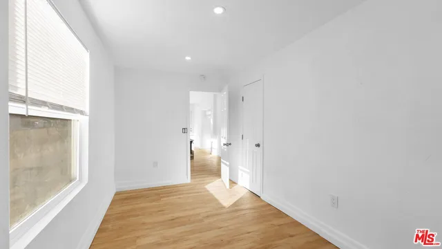 a bathroom with a tub shower and sink