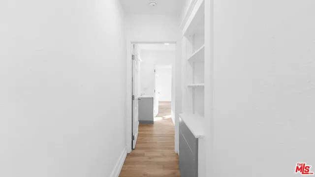 a view of an empty room with windows