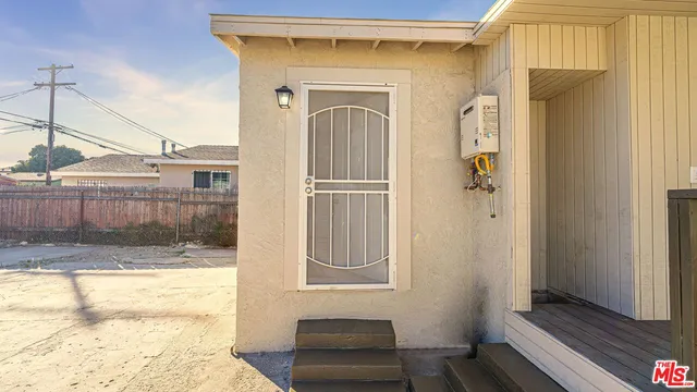 a view of a kitchen with wooden floor