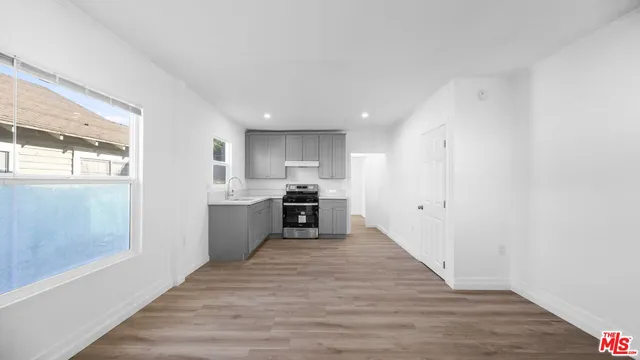 a bathroom with a sink mirror and toilet