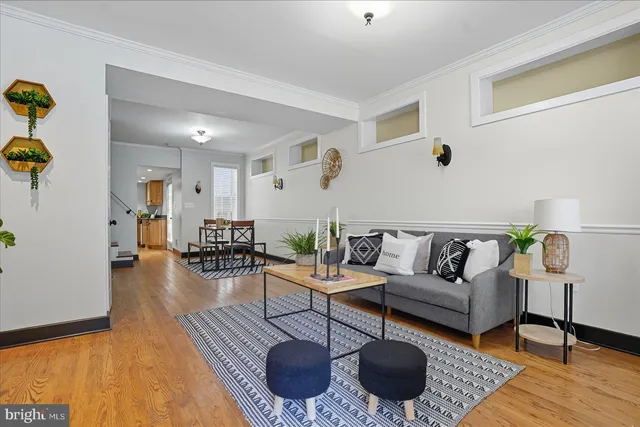 a living room with furniture and a rug