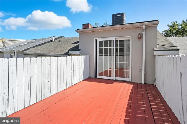 a front view of a house with a large window