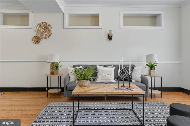 a living room with furniture and a table