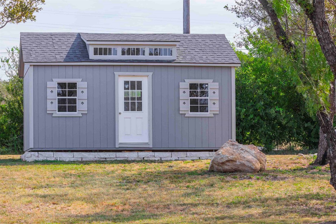 104 Lazy Oak Place Spicewood, TX 78669 - Photo 20 of 40 a view of a house with yard swimming pool and sitting area