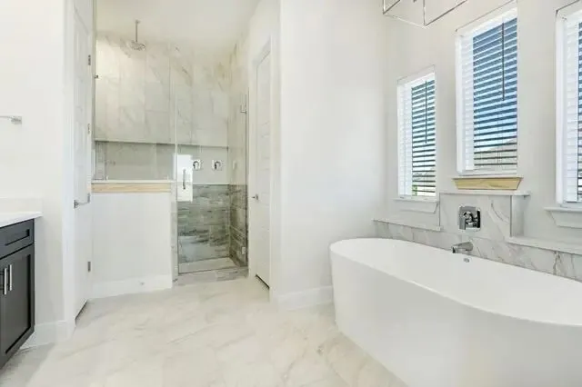 a bathroom with a bathtub and a sink