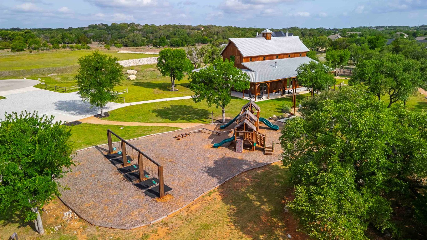 104 Lazy Oak Place Spicewood, TX 78669 - Photo 38 of 40 an aerial view of a house with outdoor space and a lake view in back