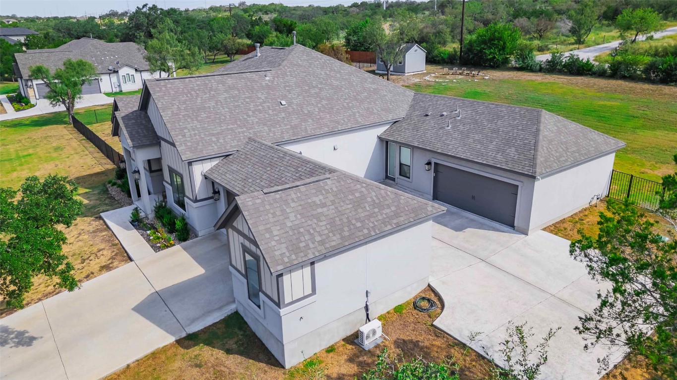 104 Lazy Oak Place Spicewood, TX 78669 - Photo 9 of 40 an aerial view of a house with backyard space and balcony