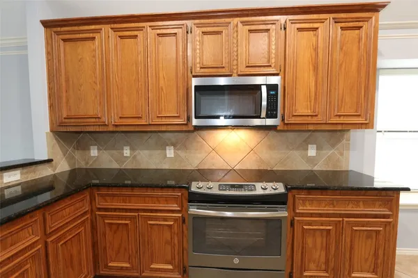 a spacious bathroom with double vanity and a mirror