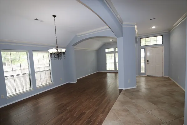 a kitchen with granite countertop a stove refrigerator and microwave