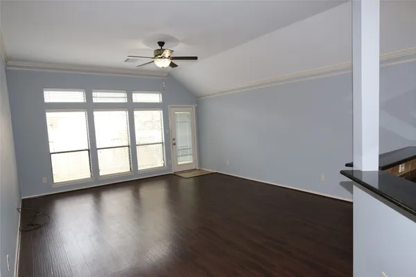 a large kitchen with stainless steel appliances granite countertop a large counter top and a stove