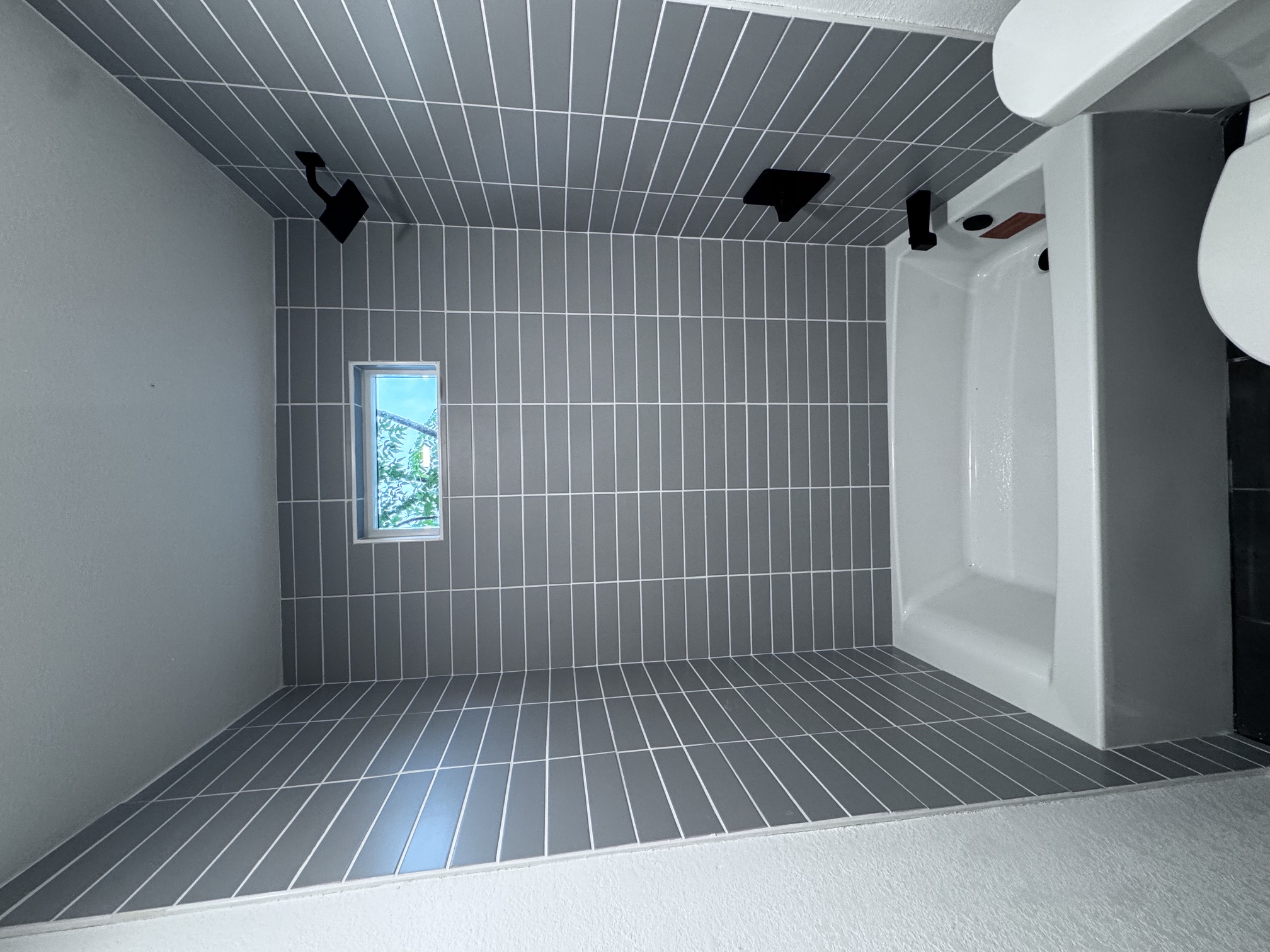 4908 Hawk Cove, Unit 2 Austin, TX 78745 - Photo 12 of 17 a bathroom with a bathtub and a shower