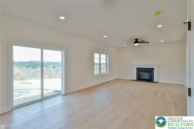 a view of an empty room with a cabinet