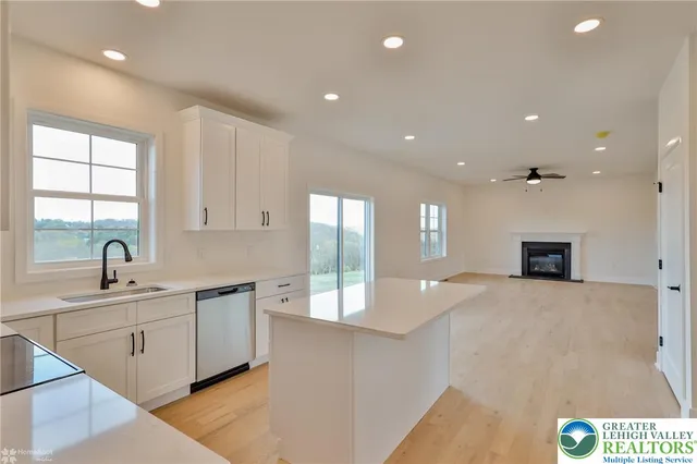 a view of a living room a window and a ceiling fan