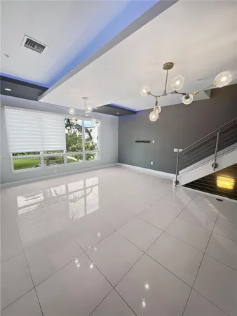 a kitchen with kitchen island a counter top space appliances and cabinets
