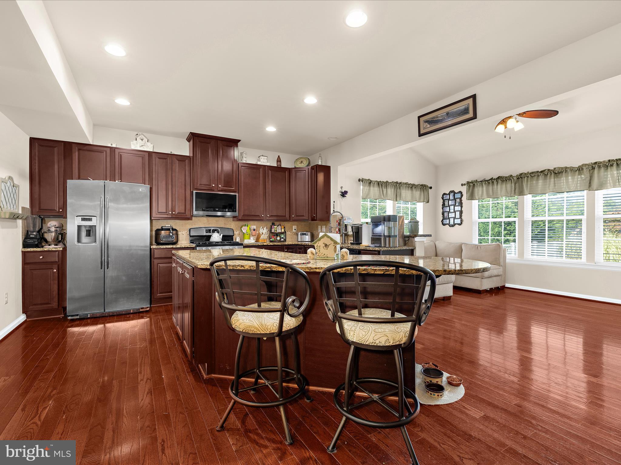 3314 Rosary Court Abingdon, MD 21009 - Photo 21 of 87 a kitchen with granite countertop lots of wooden furniture and stainless steel appliances