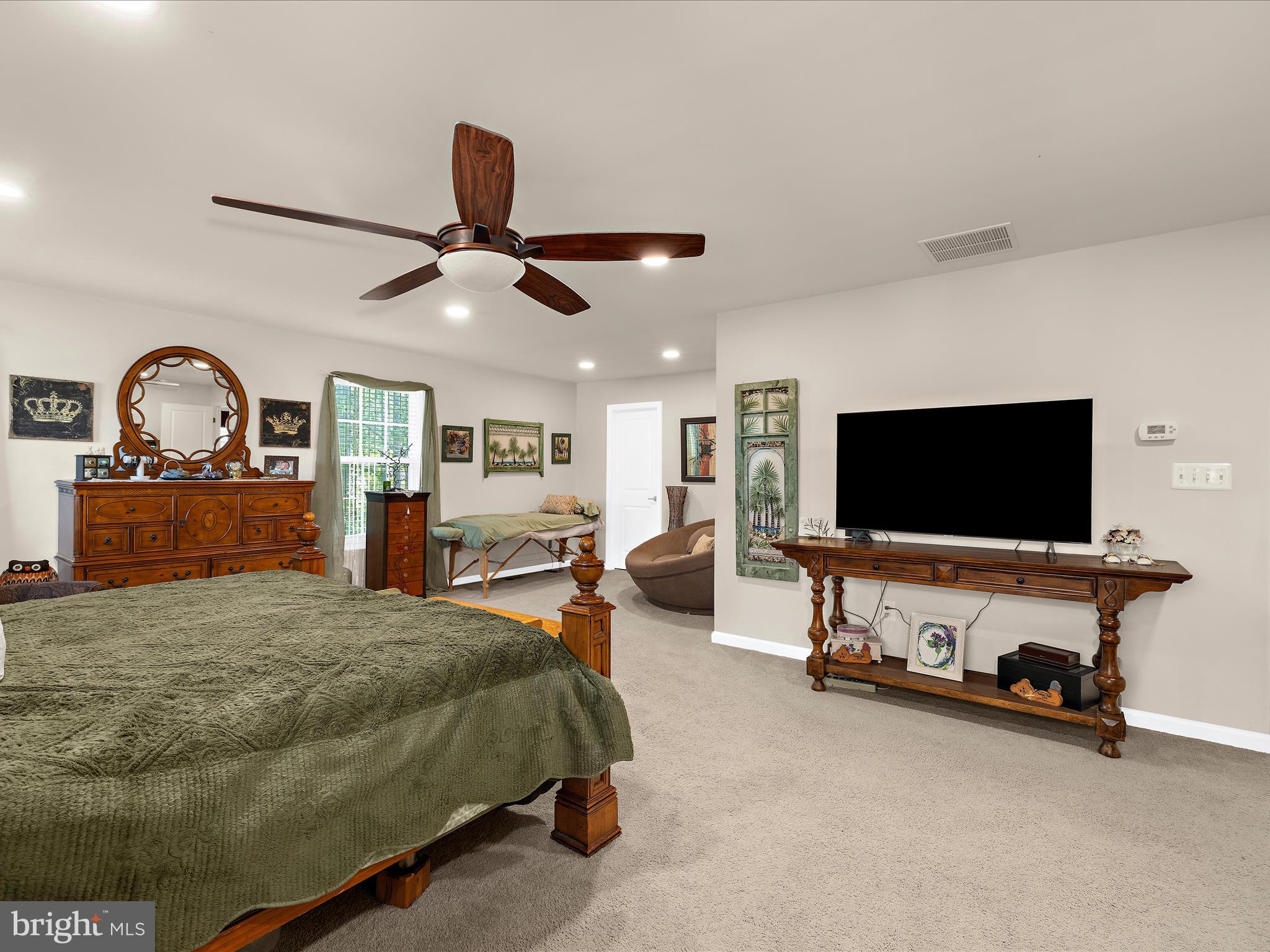 3314 Rosary Court Abingdon, MD 21009 - Photo 31 of 87 a spacious bedroom with a bed and a flat screen tv