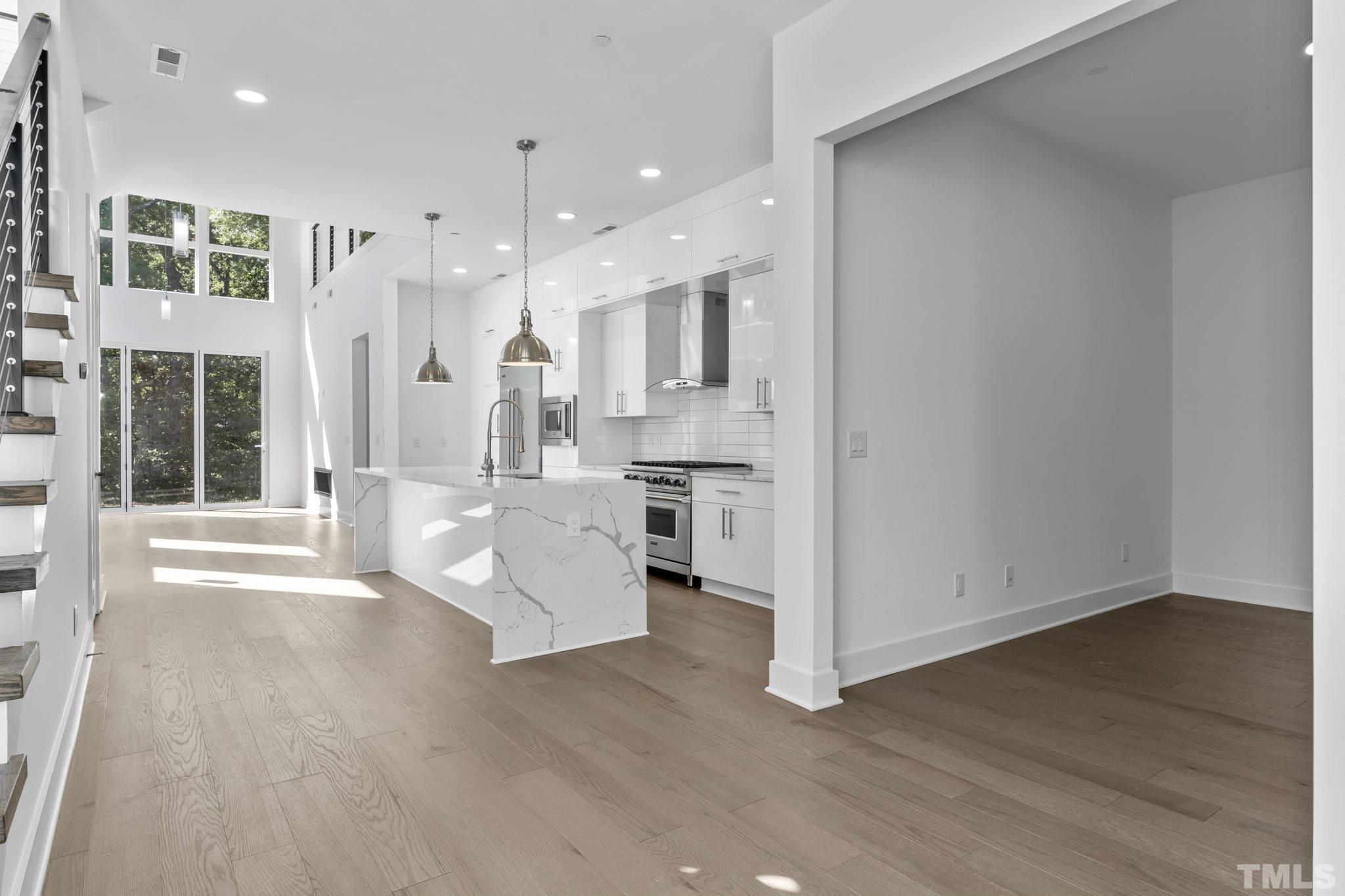 4009 Southpoint Landing Way, Unit 5 Durham, NC 27707 - Photo 14 of 43 a view of kitchen with stainless steel appliances refrigerator oven and cabinets