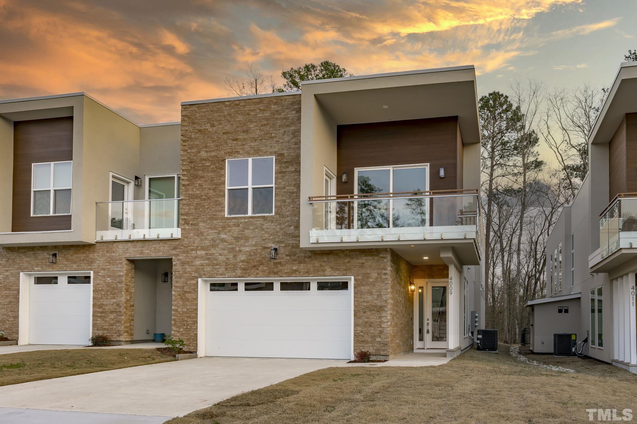 4009 Southpoint Landing Way, Unit 5 Durham, NC 27707 - Photo 2 of 43 a front view of a house with a yard