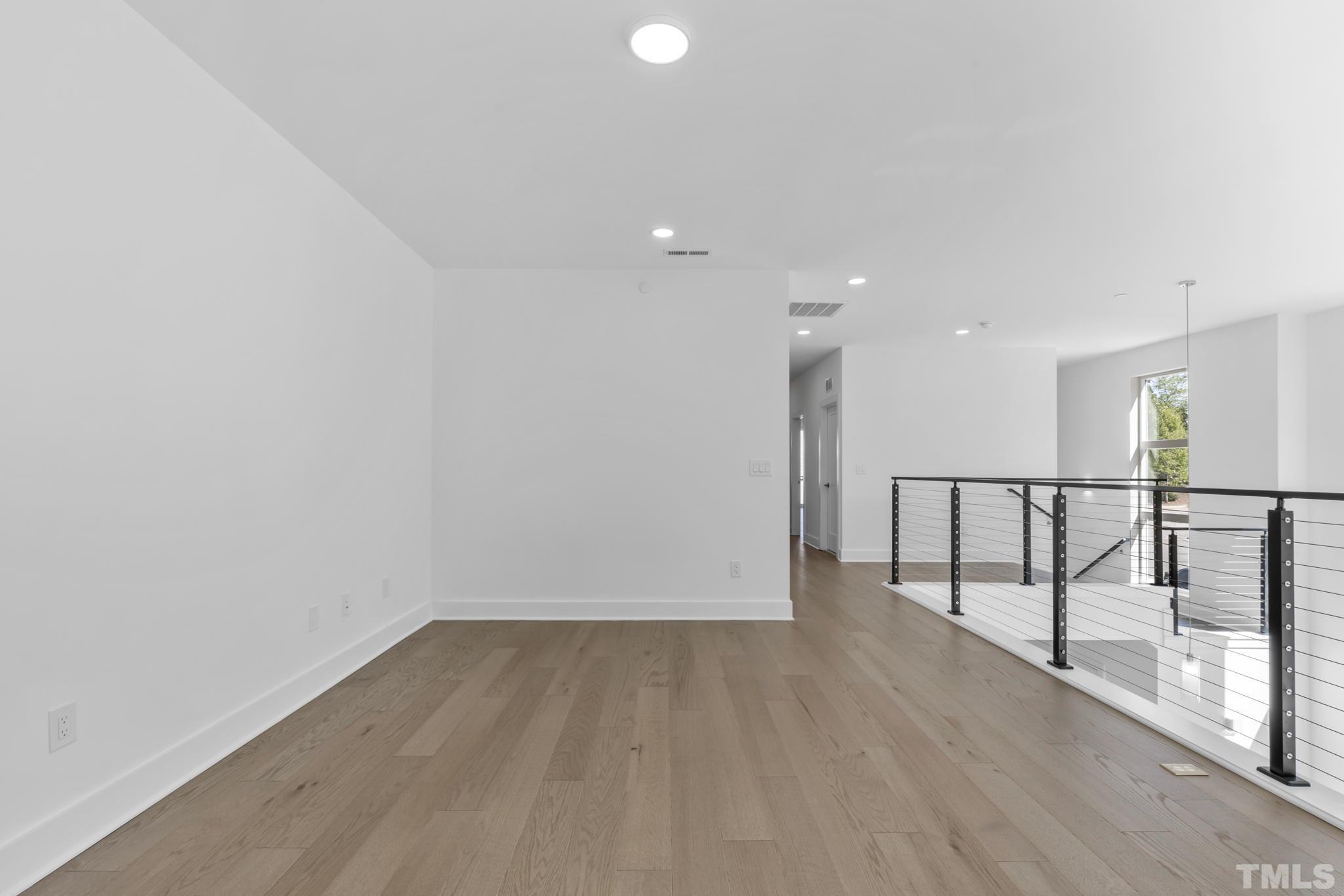 4009 Southpoint Landing Way, Unit 5 Durham, NC 27707 - Photo 21 of 43 a view of a hallway with wooden floor