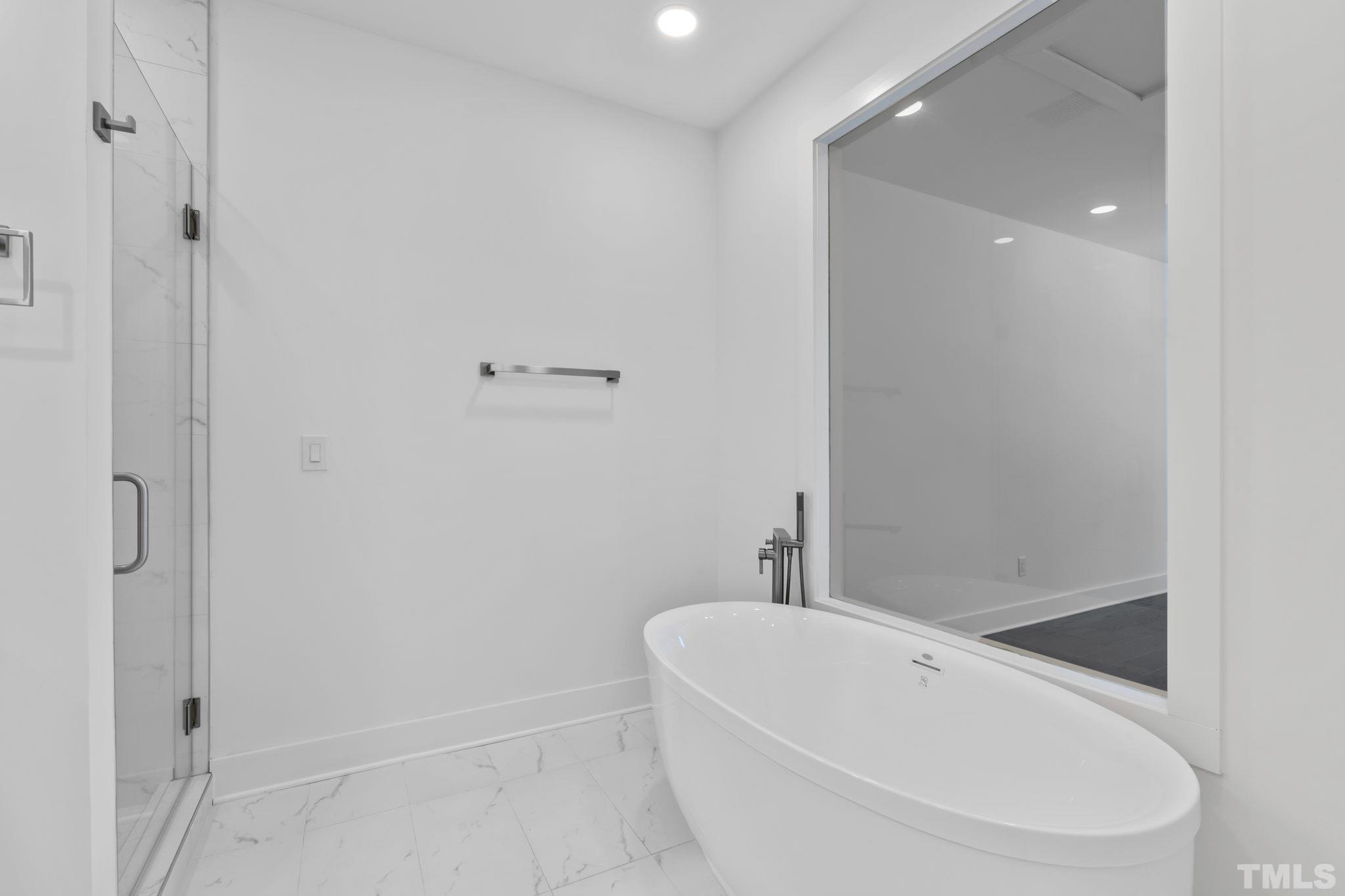 4009 Southpoint Landing Way, Unit 5 Durham, NC 27707 - Photo 23 of 43 a white bath tub sitting next to a white toilet