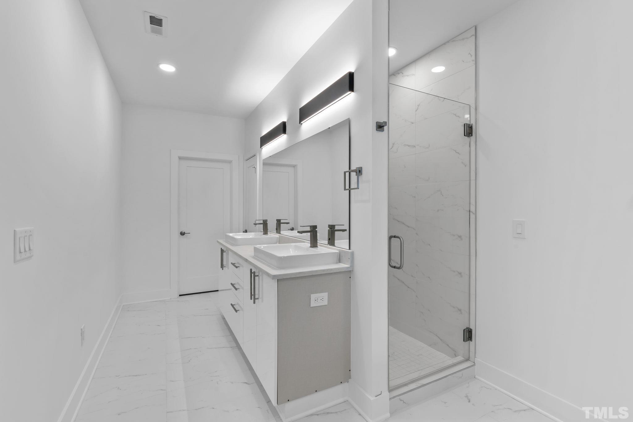 4009 Southpoint Landing Way, Unit 5 Durham, NC 27707 - Photo 24 of 43 a bathroom with a sink a toilet and shower