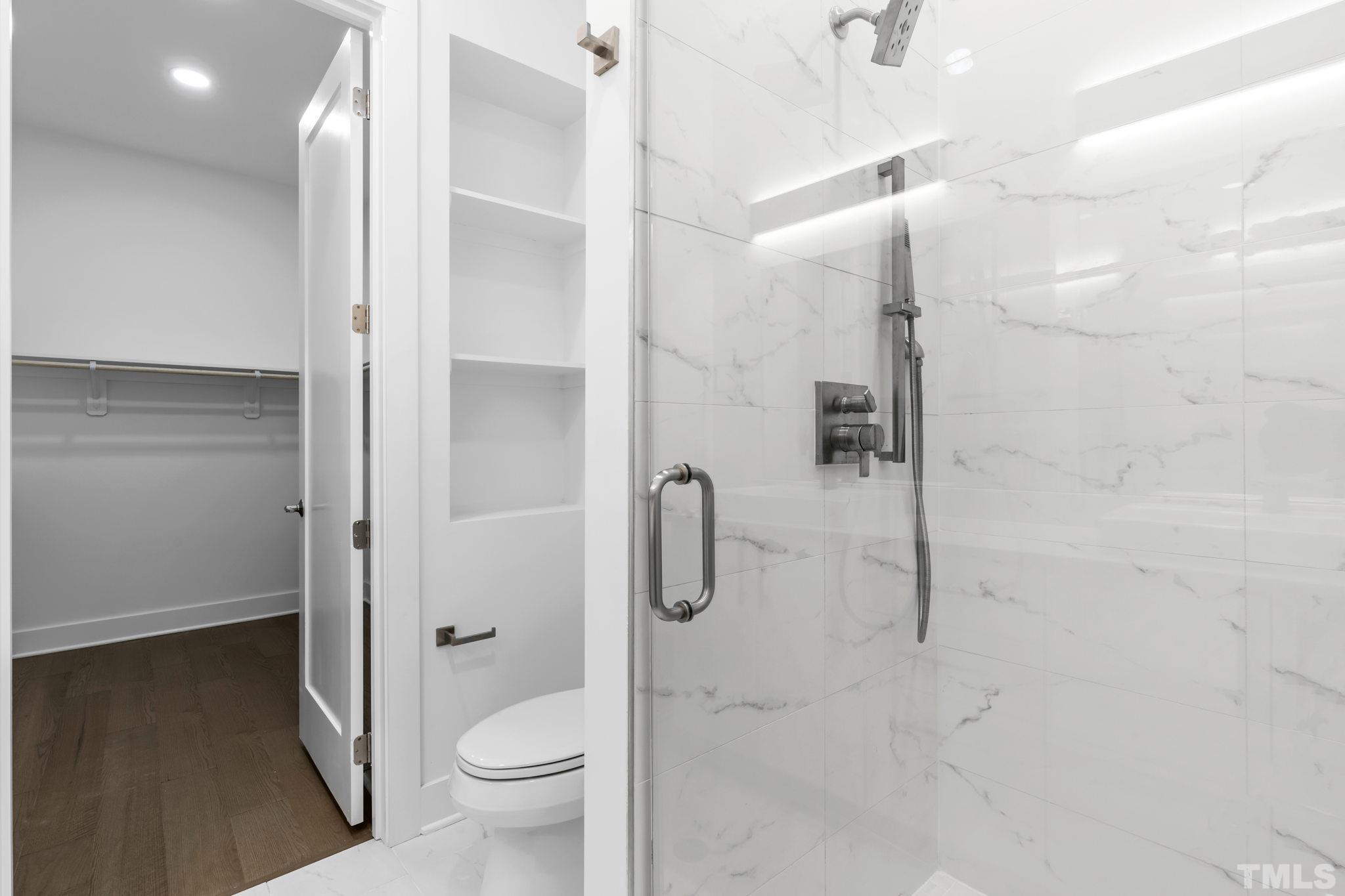 4009 Southpoint Landing Way, Unit 5 Durham, NC 27707 - Photo 31 of 43 a bathroom with a granite countertop shower a toilet and a sink