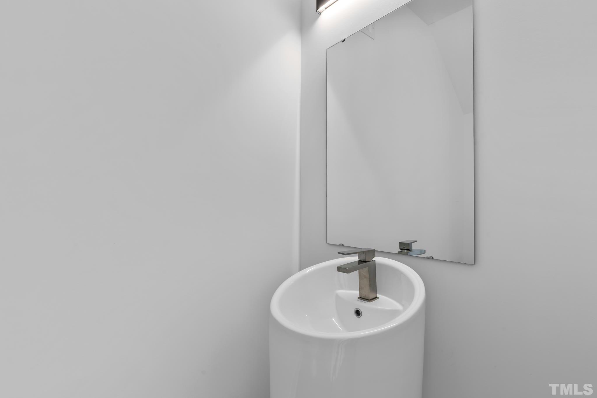 4009 Southpoint Landing Way, Unit 5 Durham, NC 27707 - Photo 33 of 43 a bathroom with a sink and a mirror